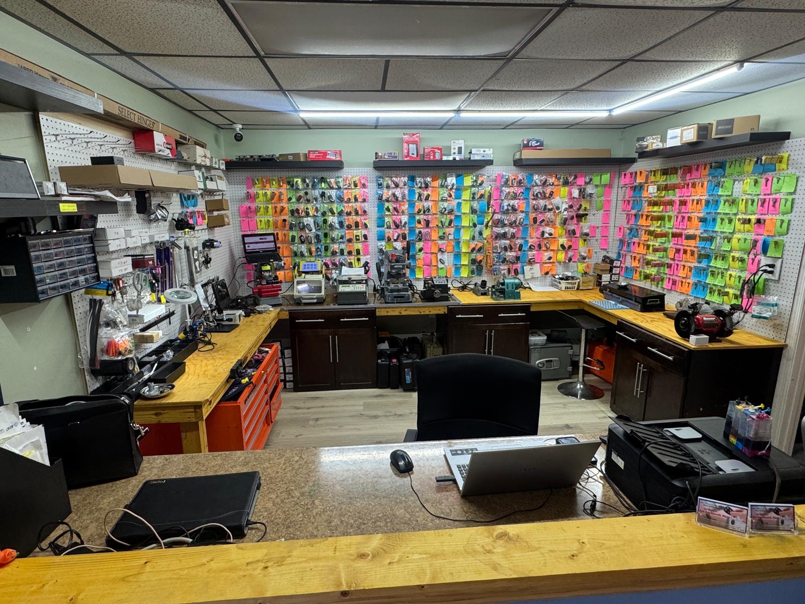 Inside our Neptune Beach locksmith shop, with key displays and key-cutting equipment